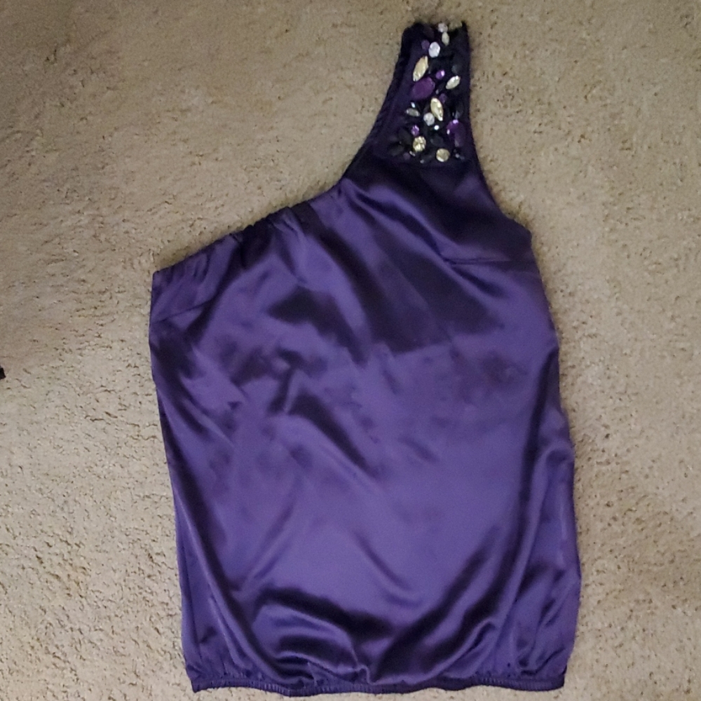 One shoulder purple top with jewls on the one shou